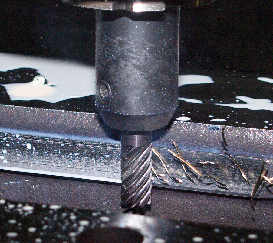 CNC milling of an aluminum sign component at Pro-Care Sign's Chicago shop