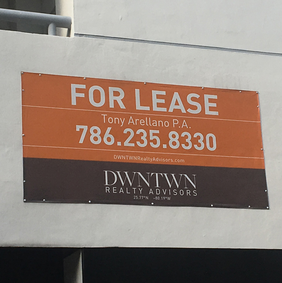Custom outdoor vinyl banner for lease installation