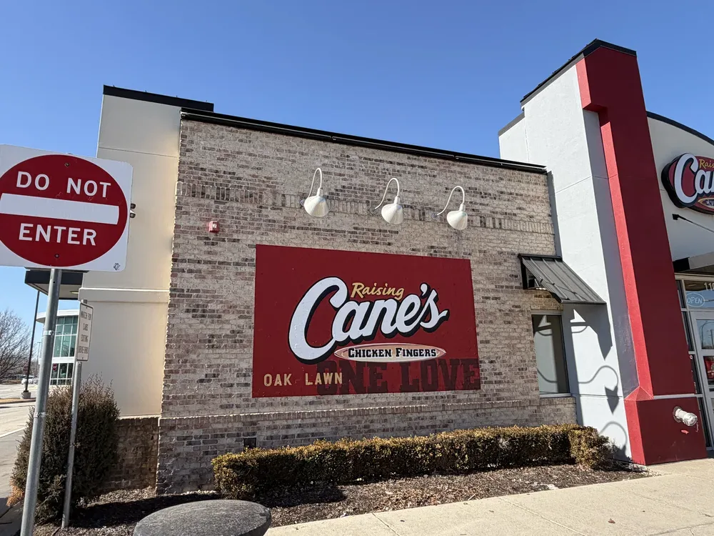 Exterior dimensional letter sign installation on building facade in Chicago, IL