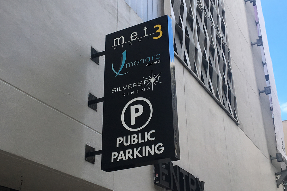 Custom illuminated cabinet sign on a commercial building