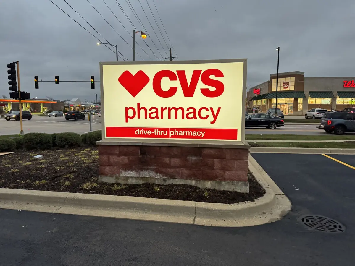 CVS Pharmacy illuminated cabinet sign with drive-thru pharmacy panel