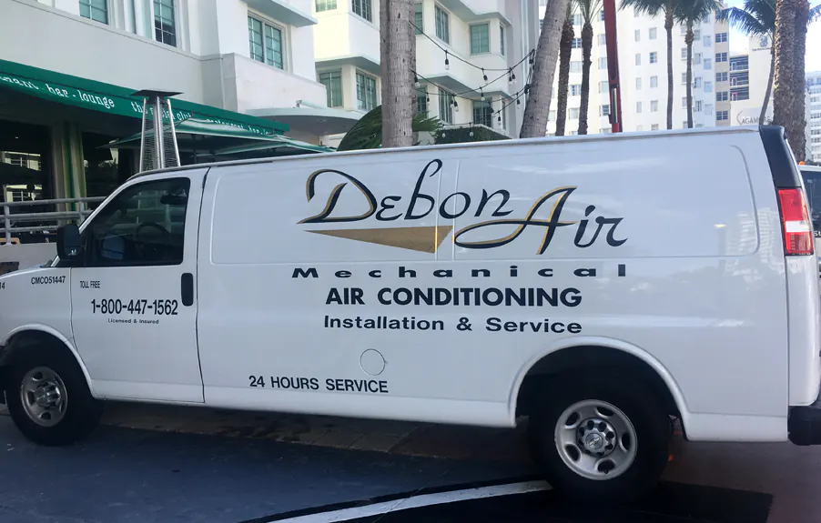 Cut vinyl lettering and logo on a white cargo van for an air conditioning service company